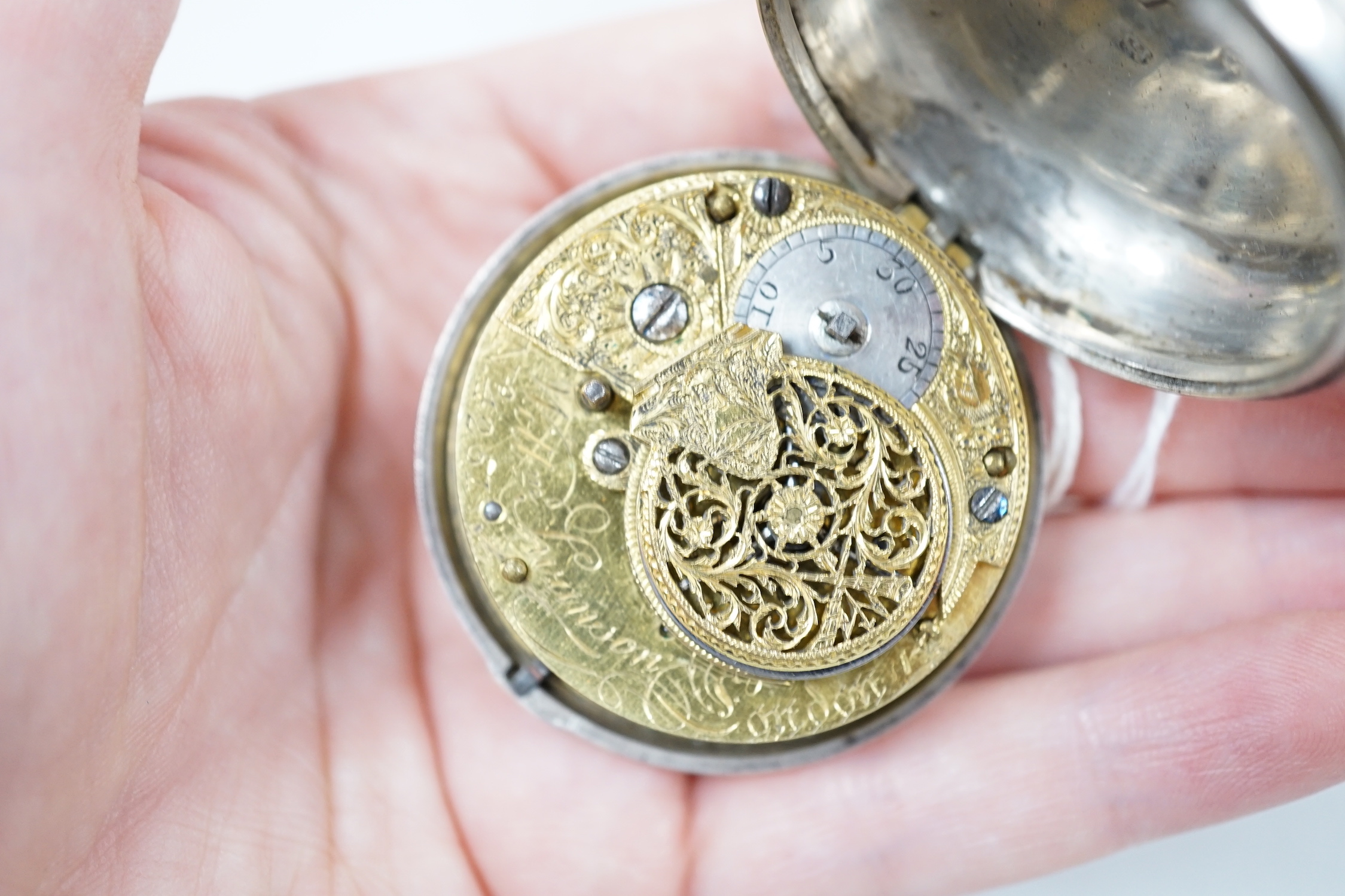 A George III silver pair cased verge pocket watch by Swanson of London, case diameter 50mm.